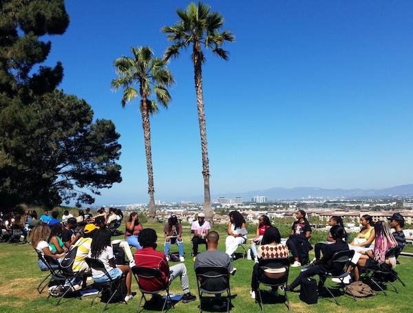 Students in a circle on the bluff